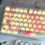 Translucent MOA keycaps in a 134-key jade dream set glow with dreamy pastel marble swirls and soft backlit gradients.