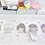 Close-up of the charming Valorant fan art desk mat, showcasing vibrant, playful agents in a row and its waterproof, non-slip surface.