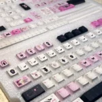 Artistic close-up of the whimsical dollhouse keycap, revealing its exquisite handcrafted miniature art and intricate details.