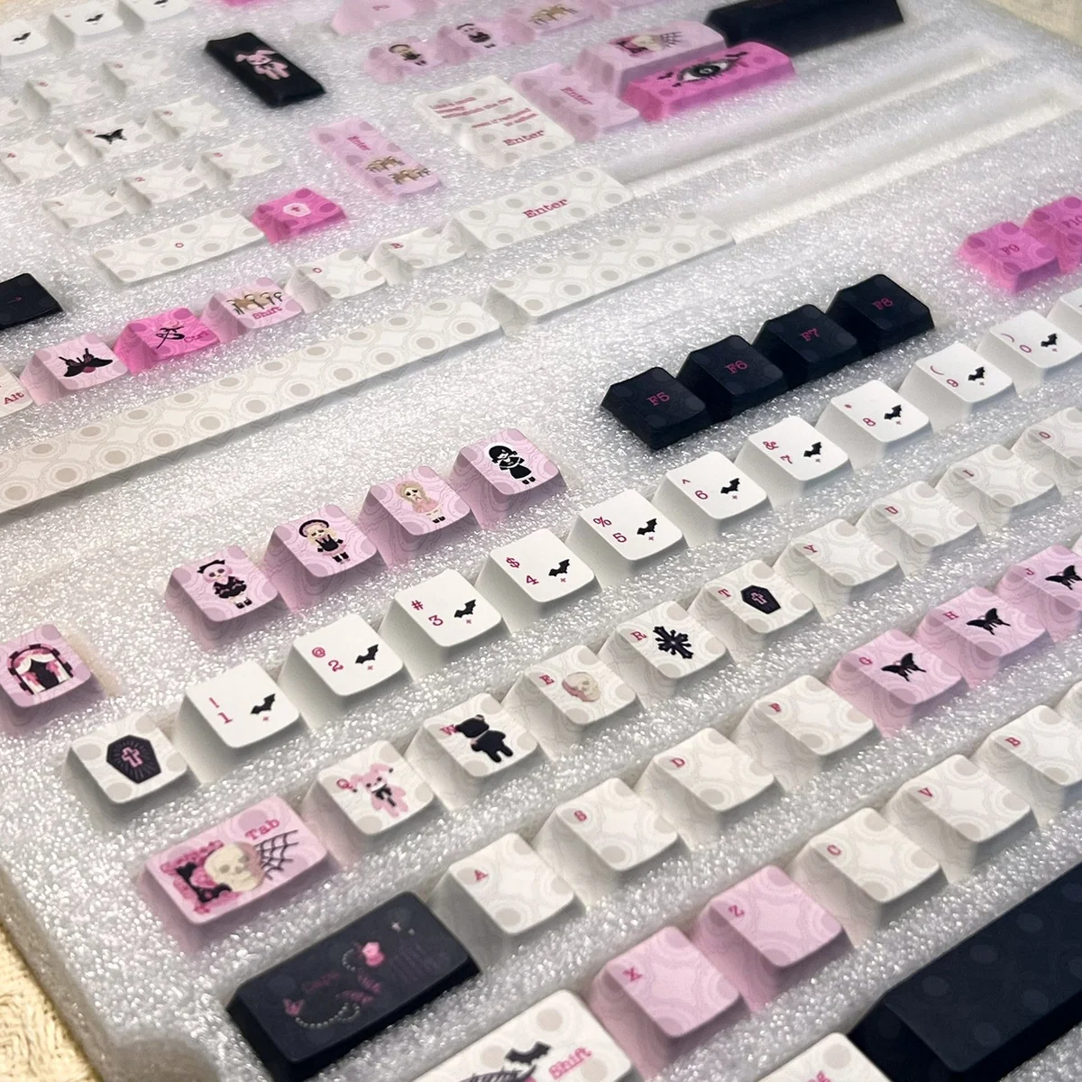 Artistic close-up of the whimsical dollhouse keycap, revealing its exquisite handcrafted miniature art and intricate details.