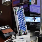 A playful, angled view of the Windows XP Crazy Edition Keycap Set, highlighting the vibrant, distorted UI elements and nostalgic retro tech.