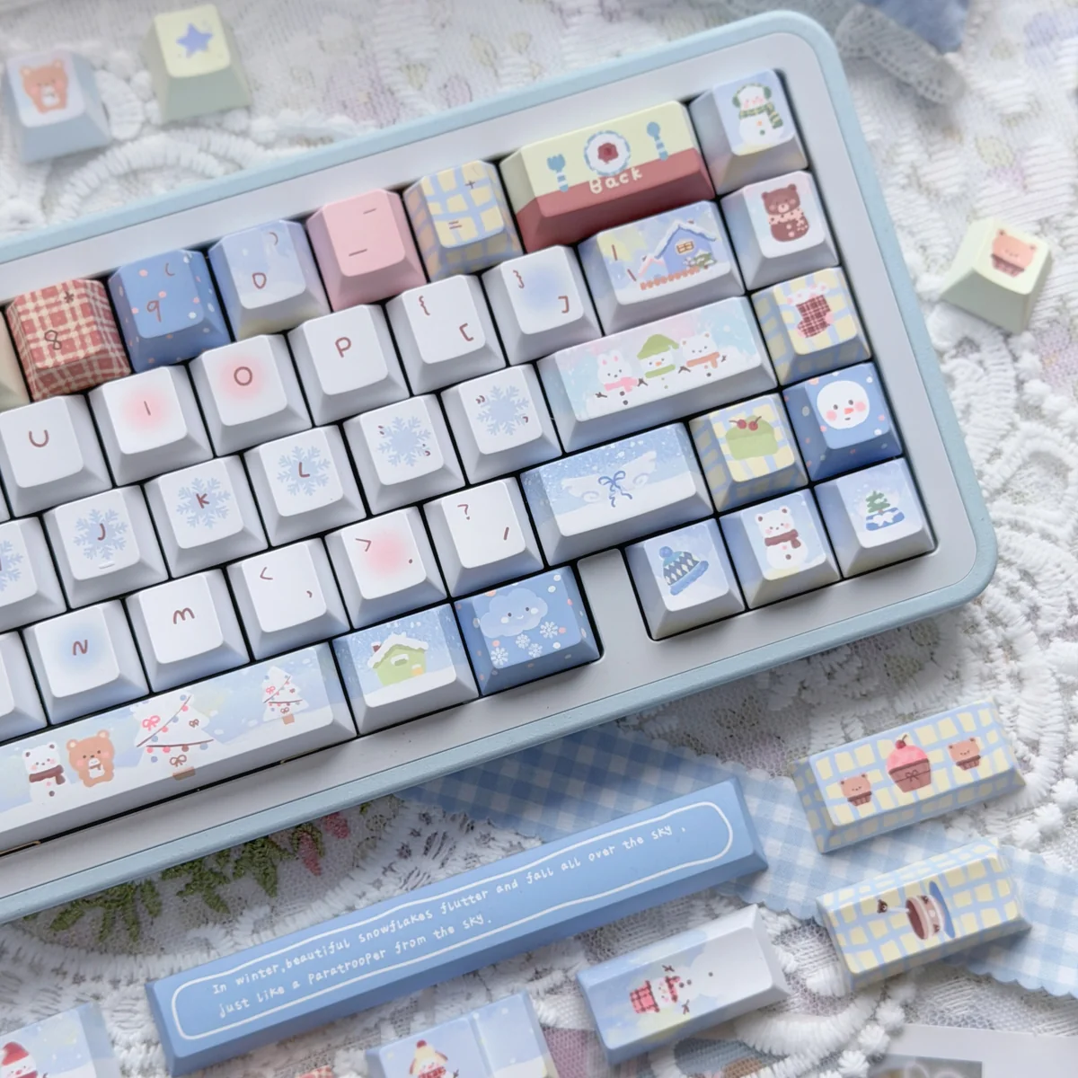 Playful Cozy Winter Bear PBT Dye-sub Keycap Set, highlighting charming bear art, snow, and muted tones from a different angle.