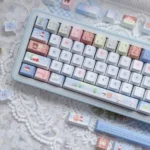 Detailed shot of the Cozy Winter Bear PBT Dye-sub Keycap Set, highlighting the charming bear characters and snowy landscape on the durable PBT keycaps.