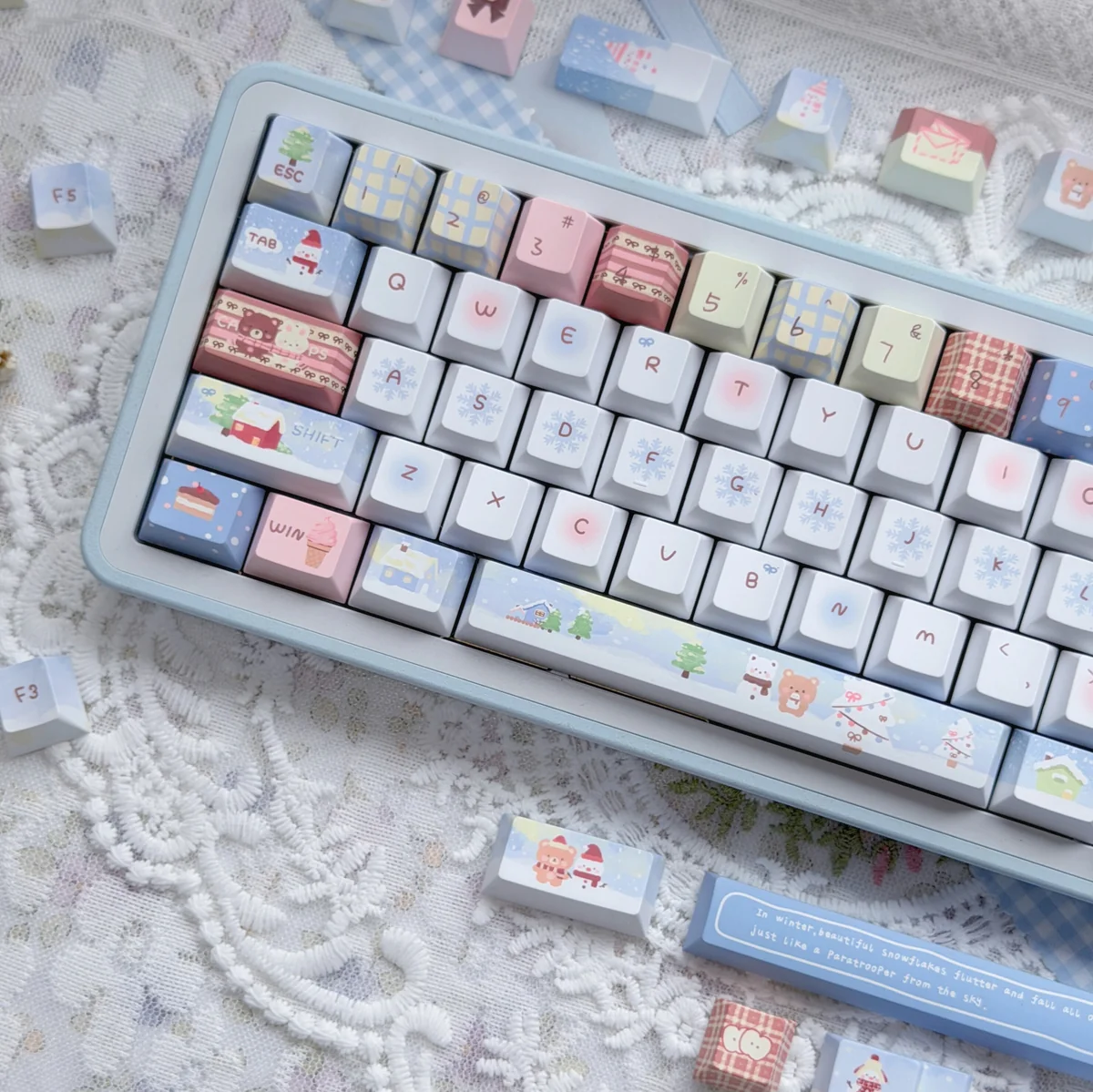 Detailed shot of the Cozy Winter Bear PBT Dye-sub Keycap Set, highlighting the charming bear characters and snowy landscape on the durable PBT keycaps.
