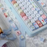 Cozy Winter Bear PBT Dye-sub Keycap Set displayed from multiple angles, featuring playful bears, snow, and charming winter scenes in muted tones.