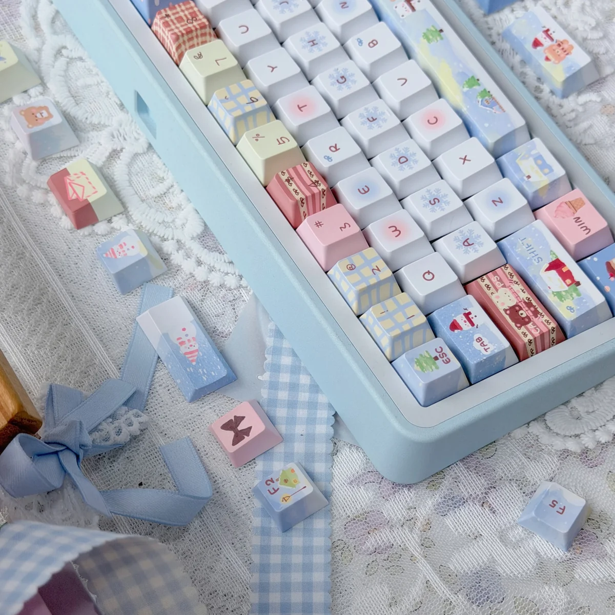 Cozy Winter Bear PBT Dye-sub Keycap Set displayed from multiple angles, featuring playful bears, snow, and charming winter scenes in muted tones.