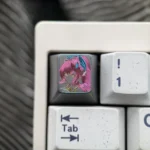 Wuthering Waves Aemeath hand-carved titanium keycap showcasing intricate futuristic details and premium metal finish from multiple angles.