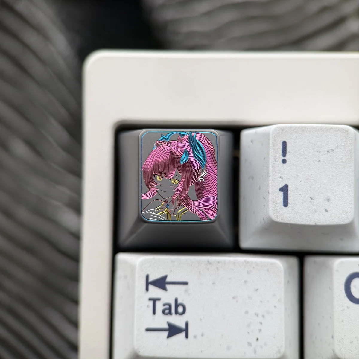 Wuthering Waves Aemeath hand-carved titanium keycap showcasing intricate futuristic details and premium metal finish from multiple angles.